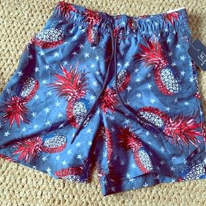 Red, white, & blue pineapple swim trunks